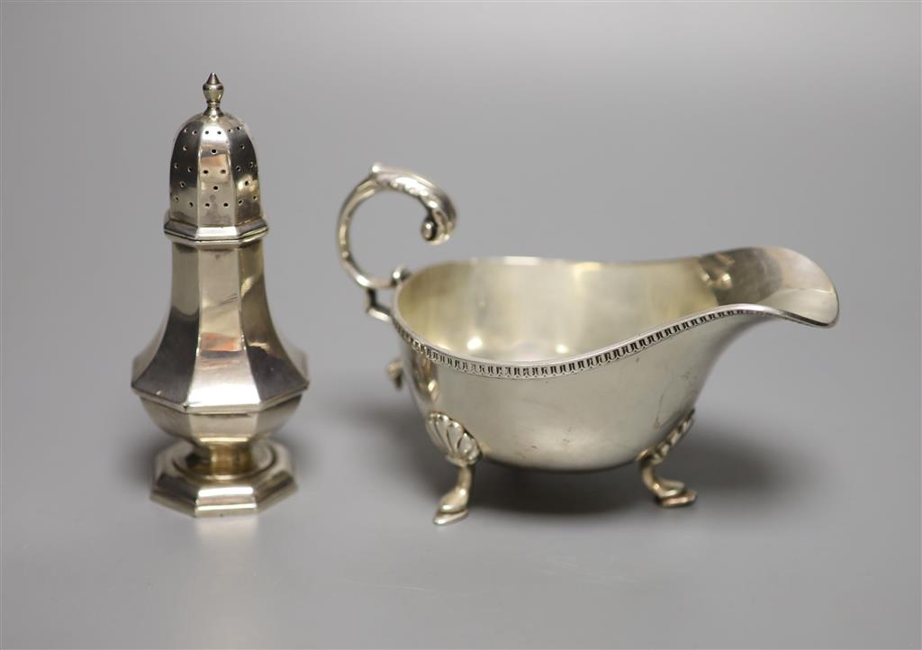 A George V silver sauceboat and an Edwardian silver pepperette, William Hutton & Sons, London, 1905, 11.7cm, 7oz.